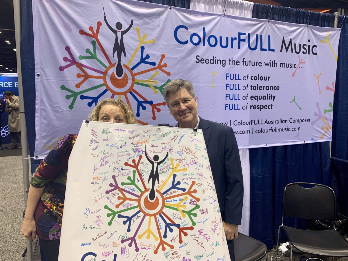 Jodie Blackshaw and Thomas C Duffy signing the 'ColourFULL Music' pledge at the Midwest Band Clinic.