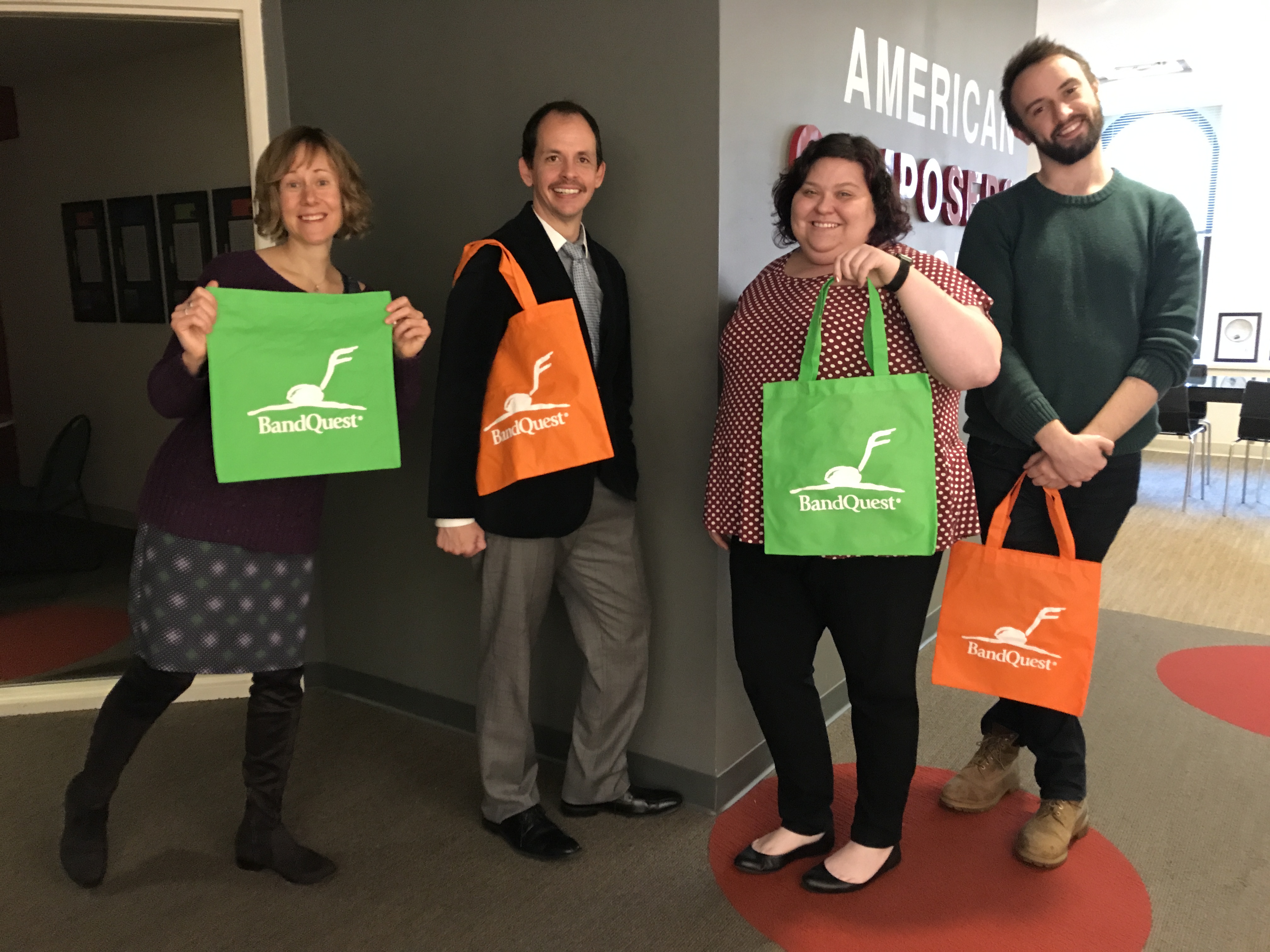 ACF staffers Kris Kautzman, Billy Lackey, Laura Krider, and Patrick Marschke show off their new BandQuest swag.
