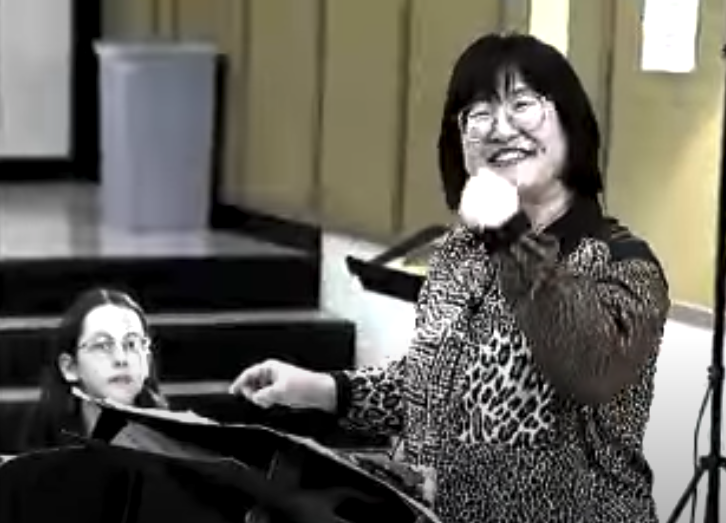 Chen Yi in rehearsal with students at Smith-Hale Junior High School in Kansas City, MO (2000).