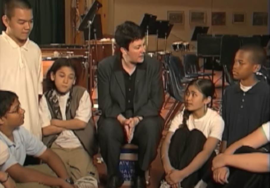 Jennifer Higdon talking with band students at Baldi Middle School Band in Philadelphia, PA (2004).